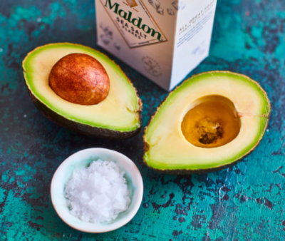 Sliced open avocado with Maldon sea salt