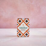 Maldon Smoked Sea Salt 125g pack. Pink background.