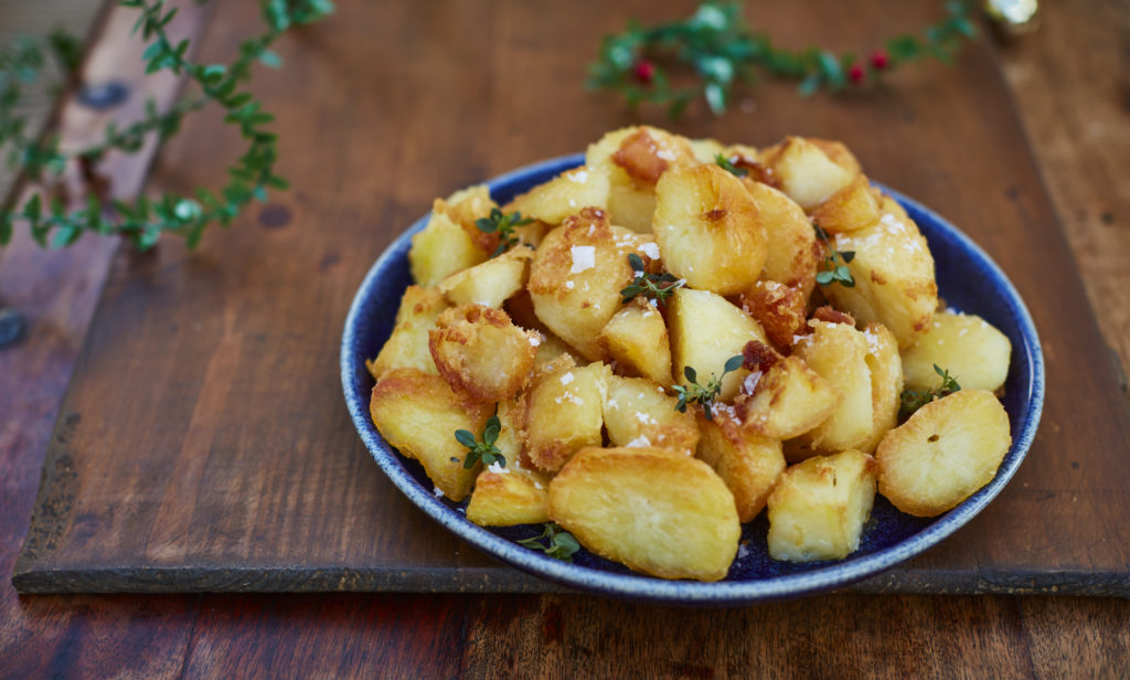 Roast potatoes on wooden table