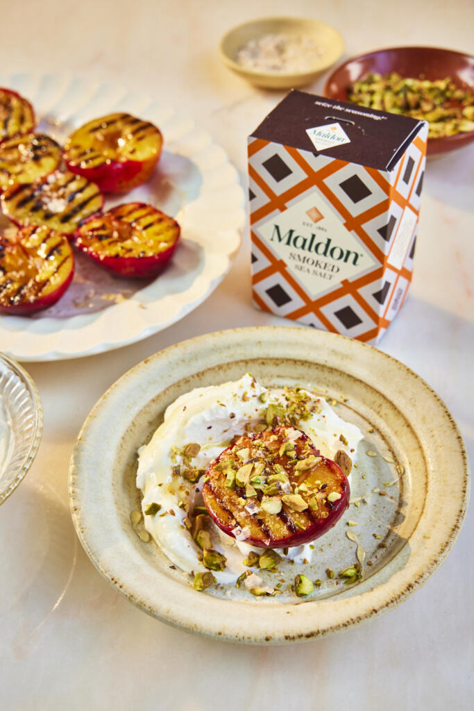 Grilled plums paired with Greek yogurt, honey and pistachios. Seasoned with Maldon Smoked Sea Salt 125g pack.