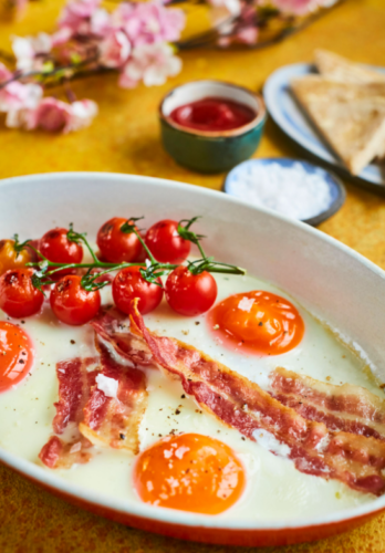 Baked eggs with bacon and tomatoes