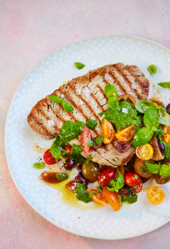 Tuna steak with salad on plate