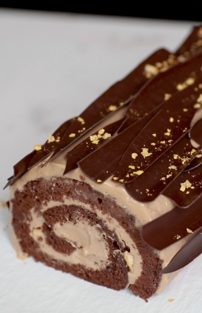 Creamy chocolate and chocolate sponge rolled into a swiss roll.