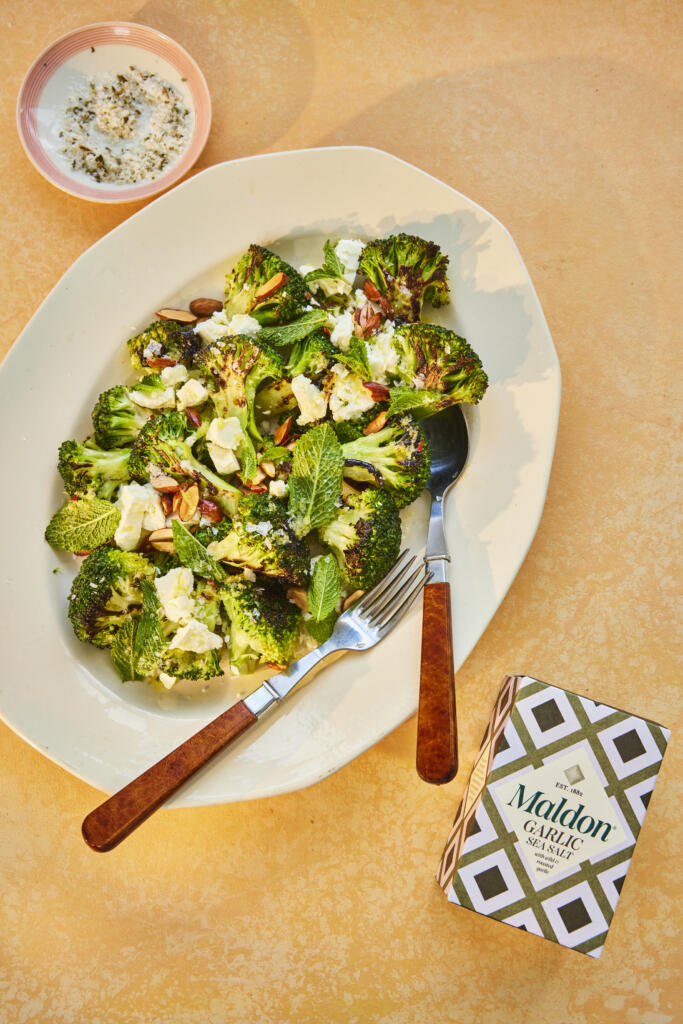 Charred broccoli salad with almonds and feta. Seasoned with Maldon Garlic Sea Salt.