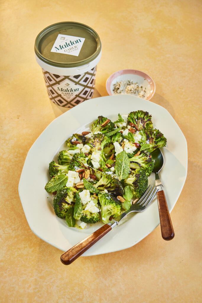 Charred Broccoli Salad paired with almonds and feta. Seasoned with Maldon Garlic Sea Salt 500g tub.
