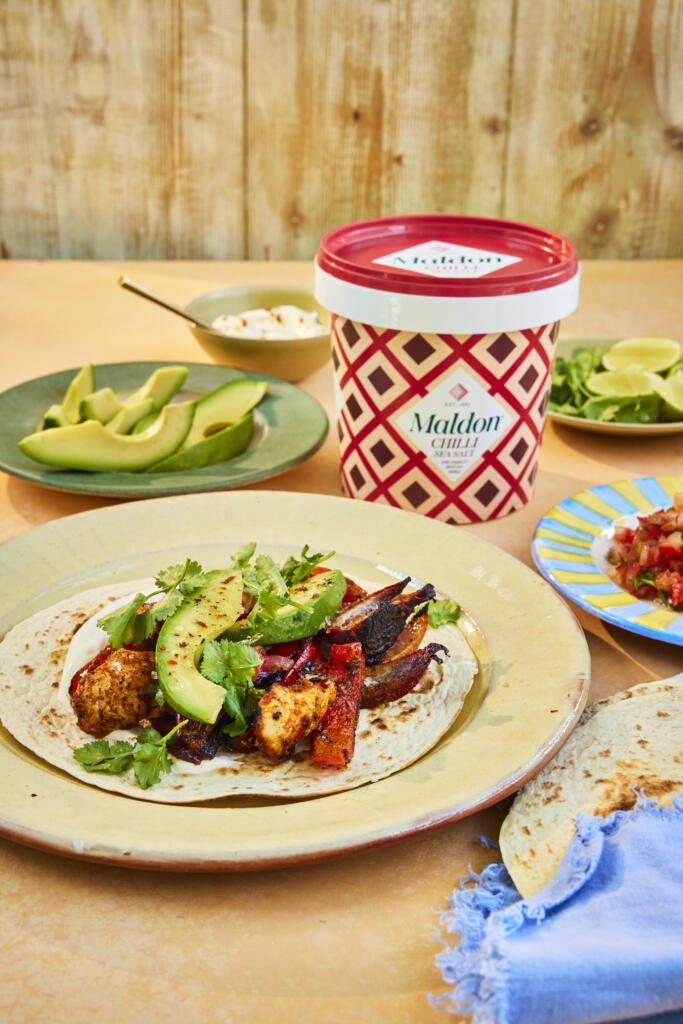Spicy chicken fajitas paired with red peppers, onions and avocado. Seasoned with Maldon Chilli Sea Salt 500g tub.