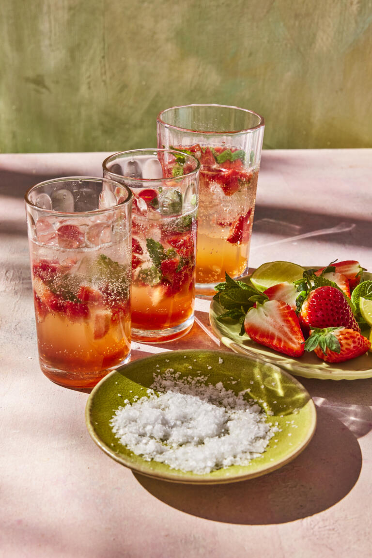 Strawberry mojitos infused with muddled strawberries, mint leaves, lime wedges and a pinch of Maldon Sea Salt flakes.