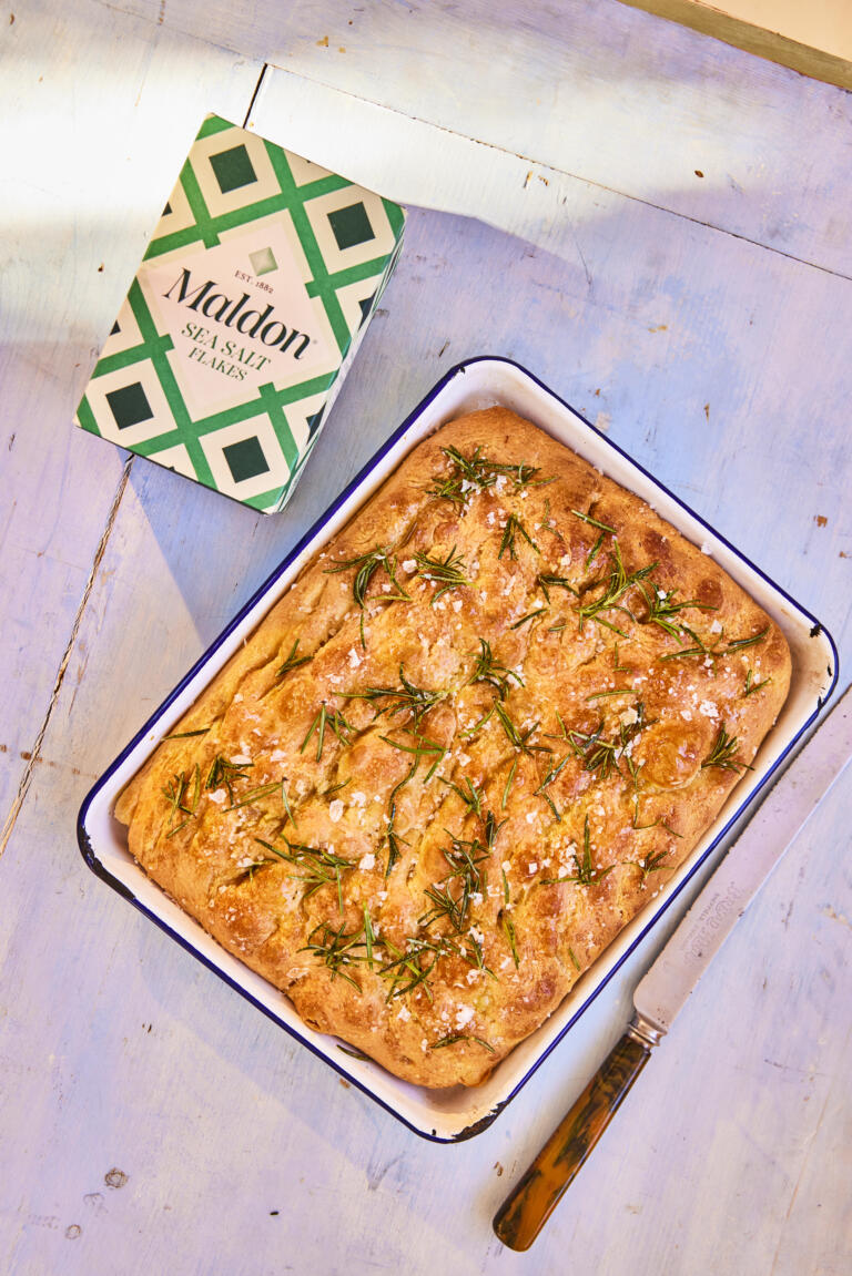 Homemade focaccia seasoned with rosemary sprigs and Maldon Sea Salt flakes.