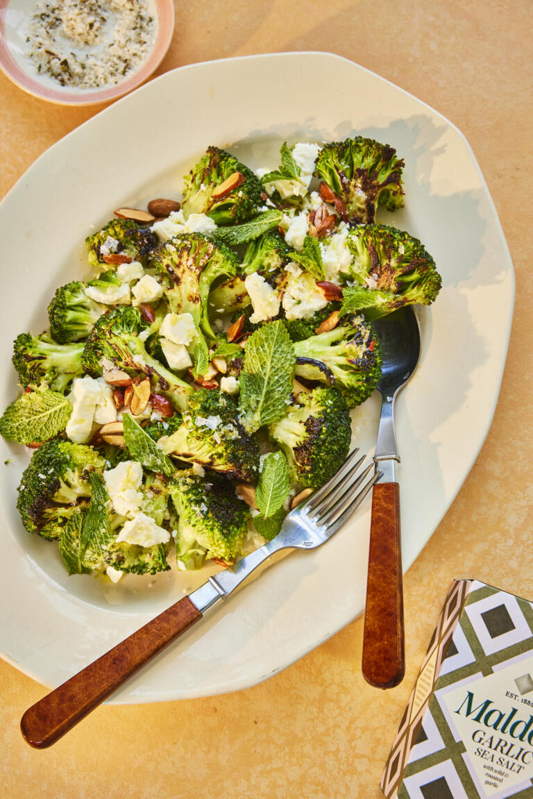 Charred broccoli salad paired with hazelnuts and feta. Seasoned with Maldon Garlic Sea Salt.