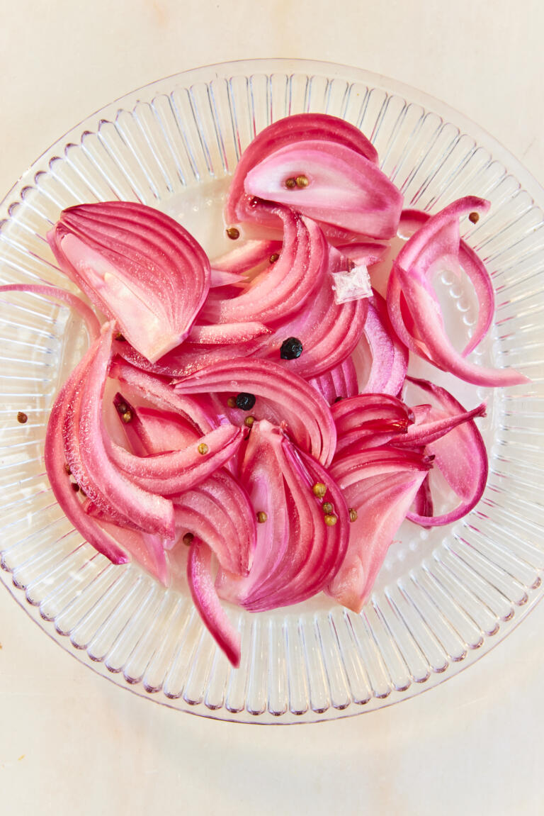 Pickled red onions, infused with apple cider vinegar, honey, coriander seeds, peppercorns, bay leaves and Maldon Sea Salt flakes.