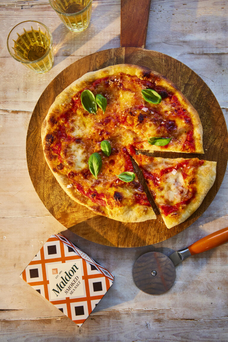 Homemade margarita pizza, seasoned with Maldon Smoked Sea Salt flakes.
